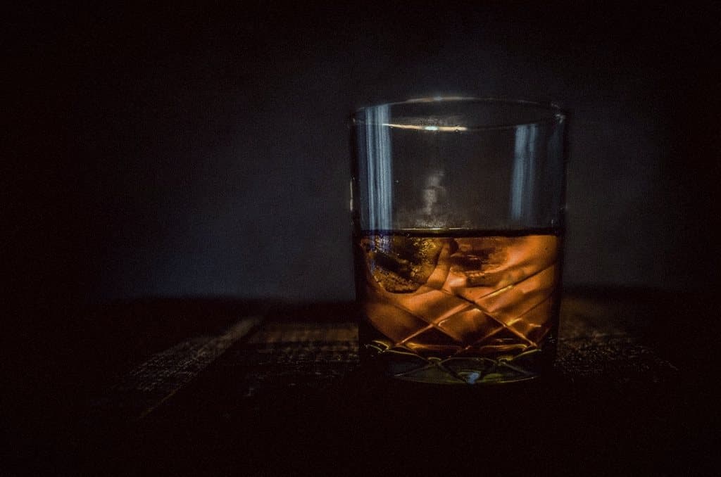 Whisky tumbler in low light