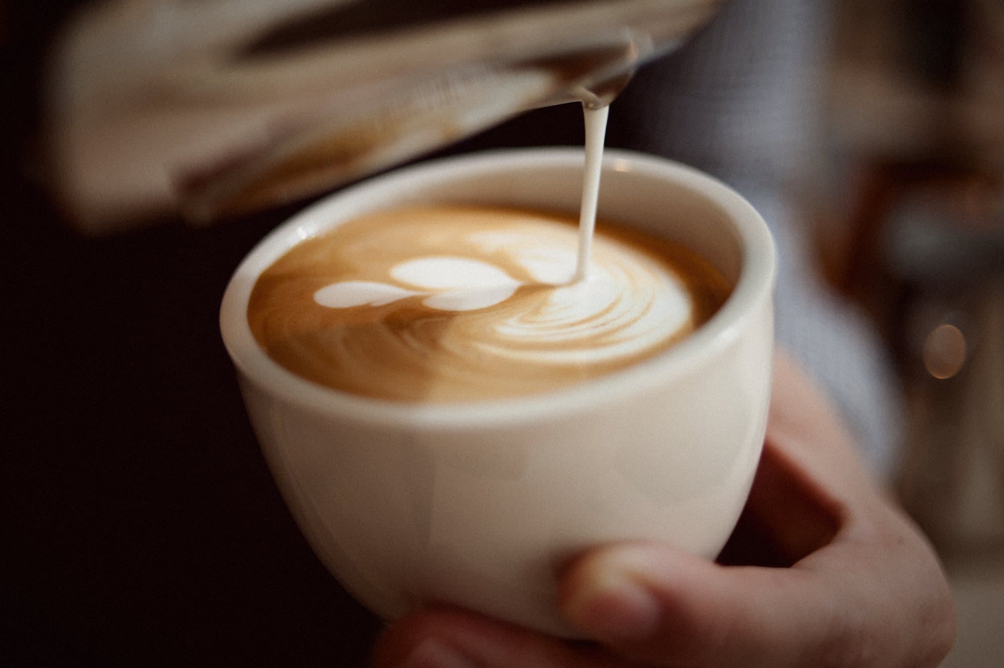 Latte art being poured